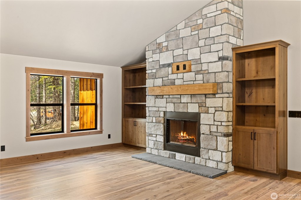 Stone fireplace and built-in cabinetry