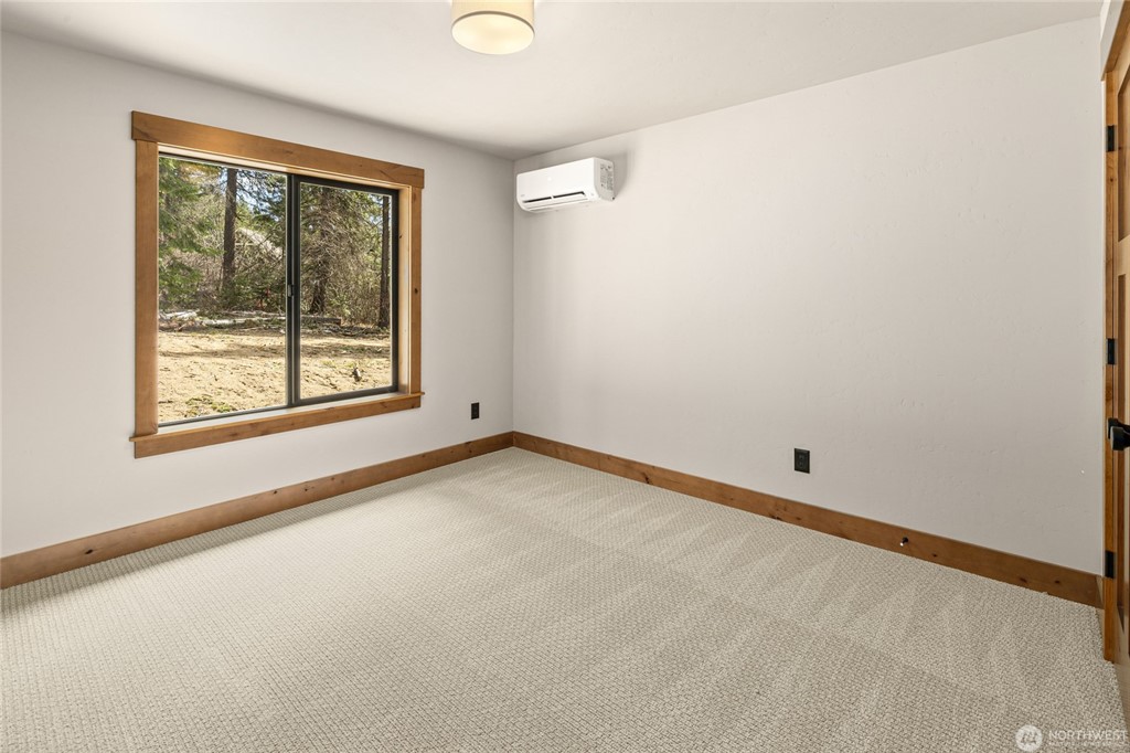 Secondary bedroom with wooded view